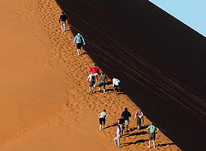 Walking up the sand dune - Diverse Namibia