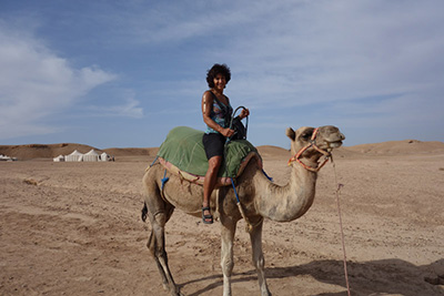 Riding camel in the Sahara desert